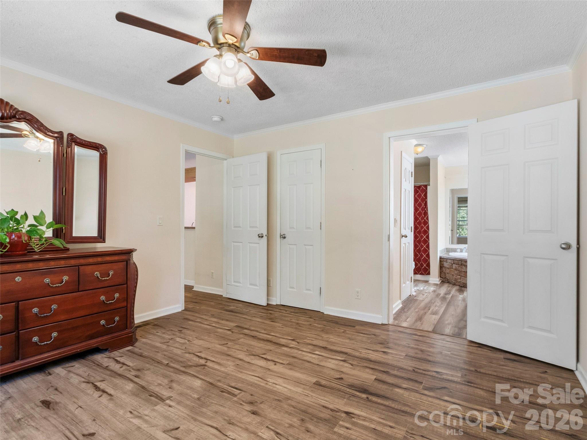 9 Sun Ridge Road Asheville, NC 28806 - Photo 13 of 29 a room that has a bed and a dresser