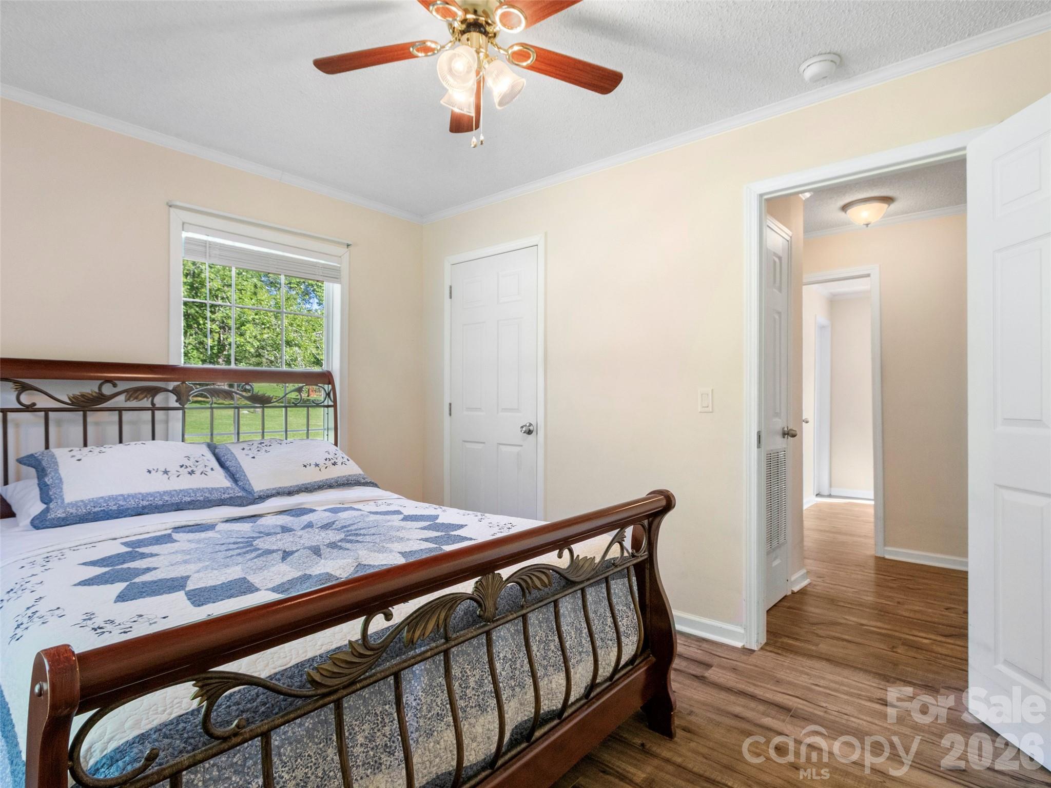 9 Sun Ridge Road Asheville, NC 28806 - Photo 15 of 29 a view of a hallway with wooden floor and chandelier