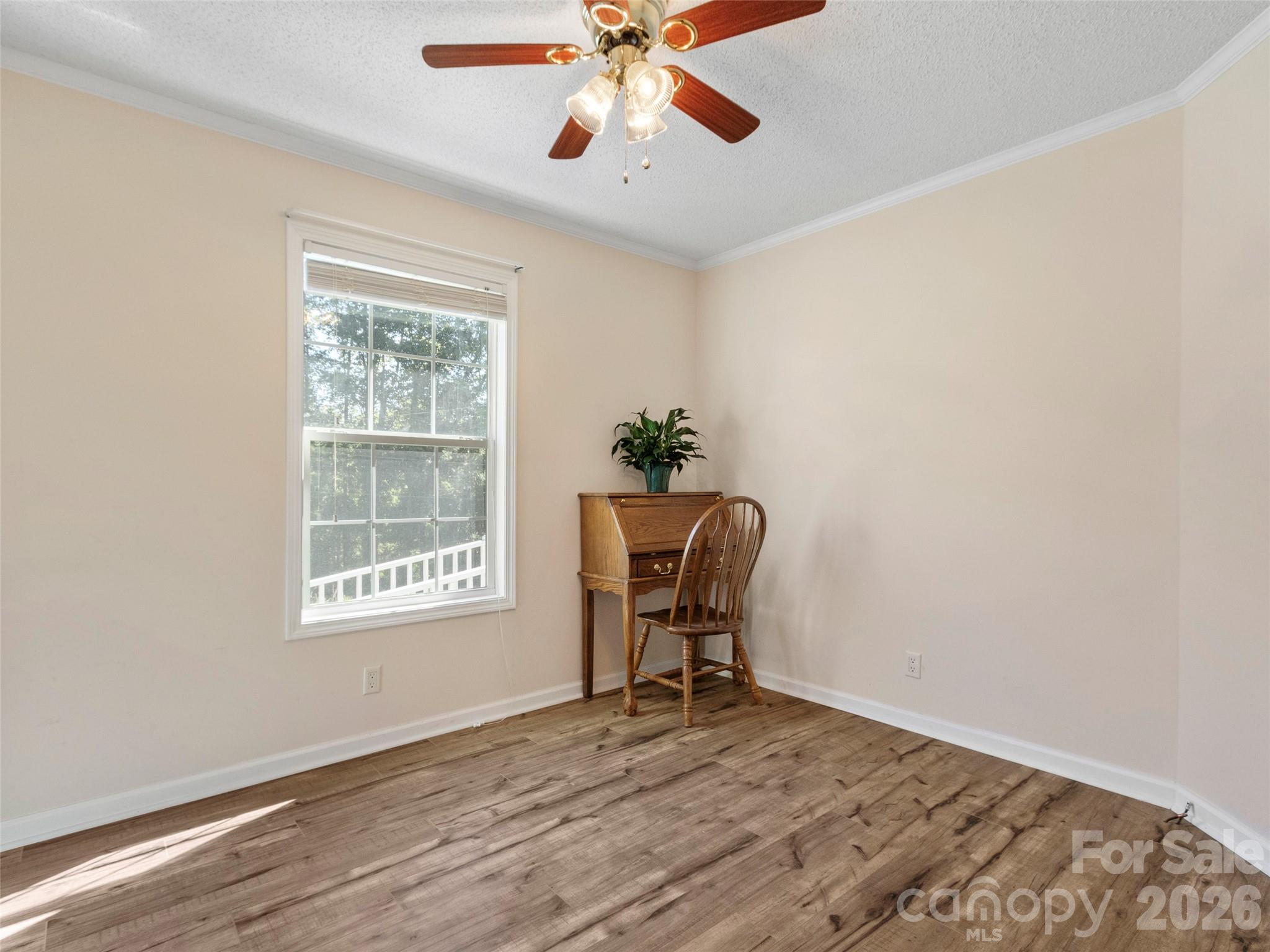 9 Sun Ridge Road Asheville, NC 28806 - Photo 17 of 29 a workspace with wooden floor and a window