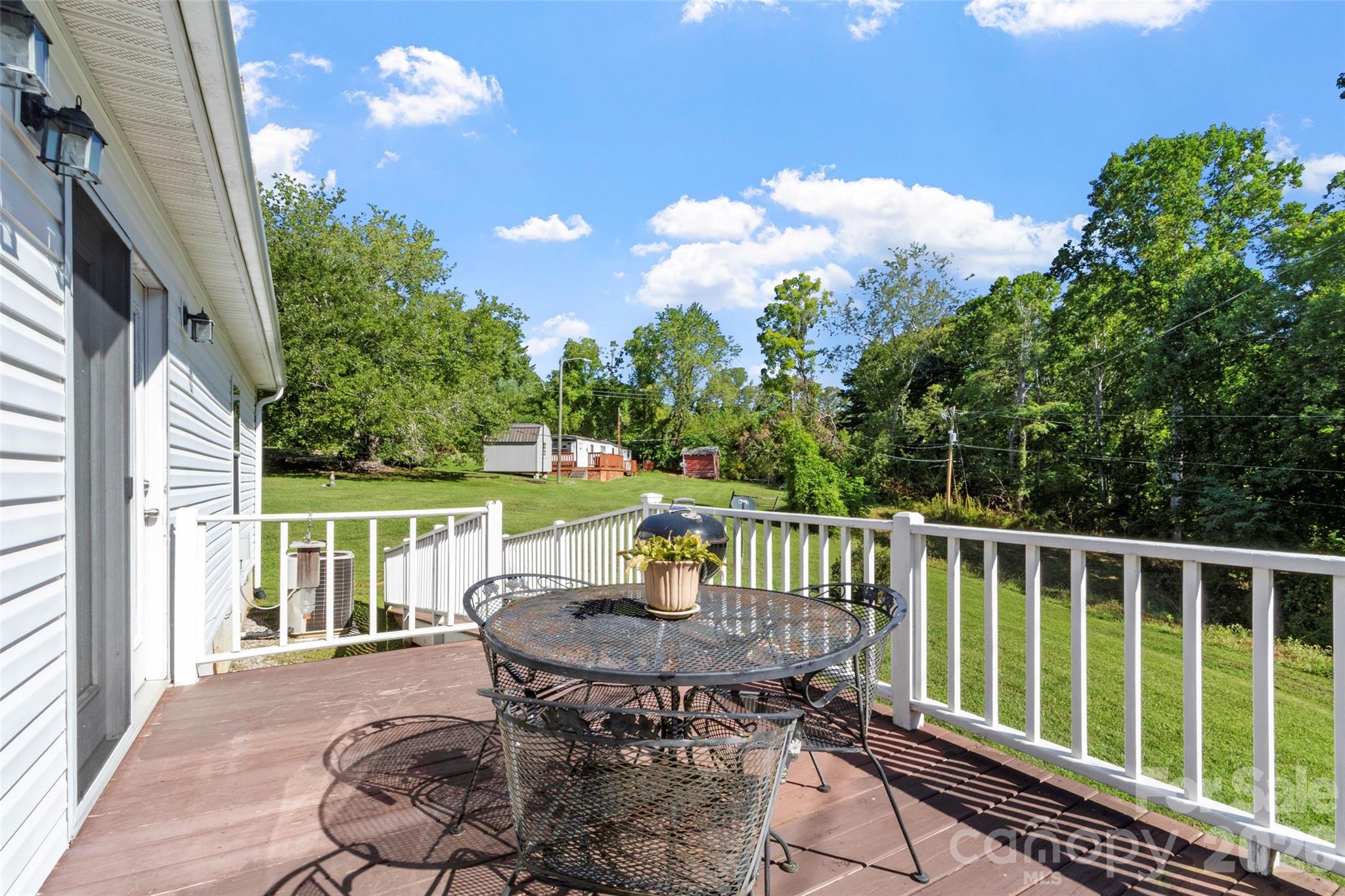 9 Sun Ridge Road Asheville, NC 28806 - Photo 22 of 29 a view of a chairs with a table in the balcony