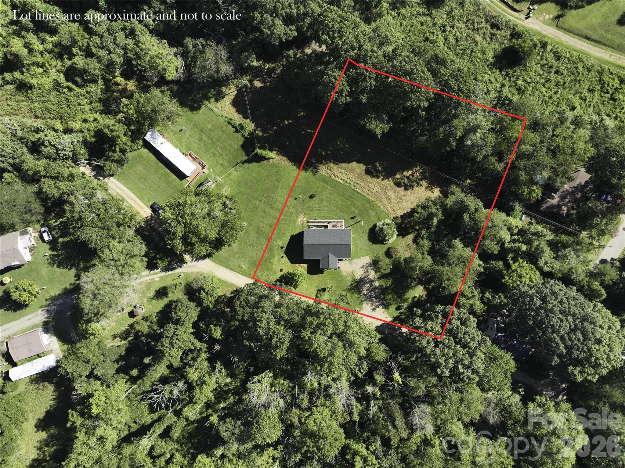 9 Sun Ridge Road Asheville, NC 28806 - Photo 29 of 29 an aerial view of a house with a yard and potted plants