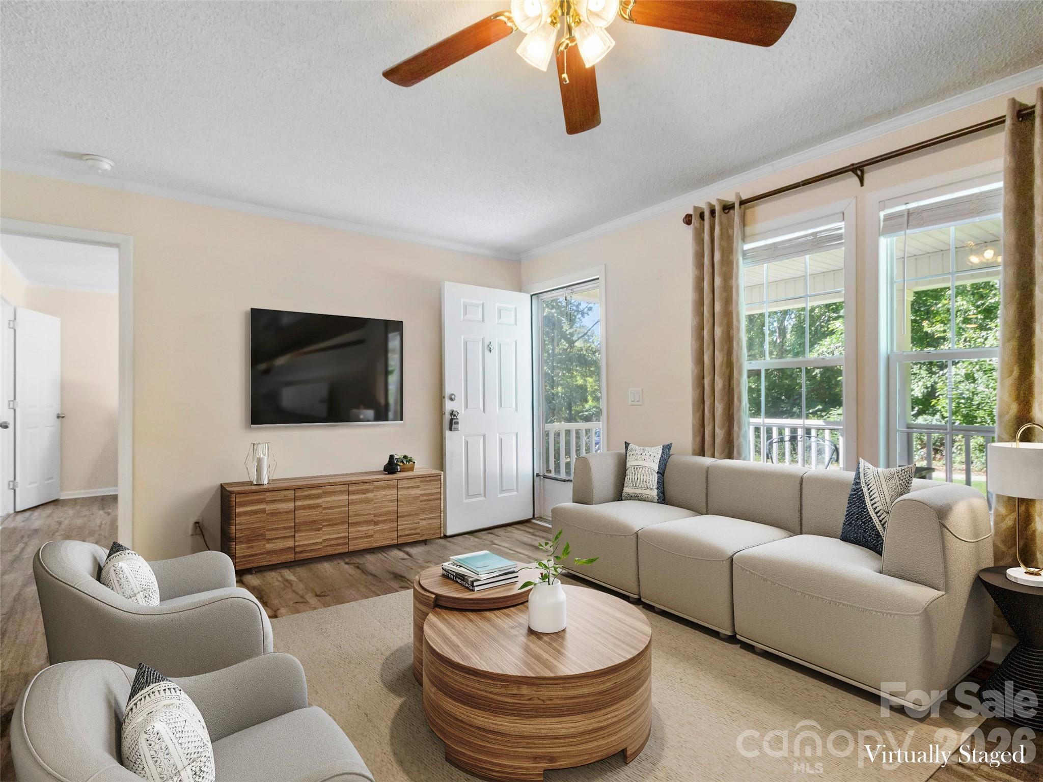 9 Sun Ridge Road Asheville, NC 28806 - Photo 3 of 29 a living room with furniture and a flat screen tv