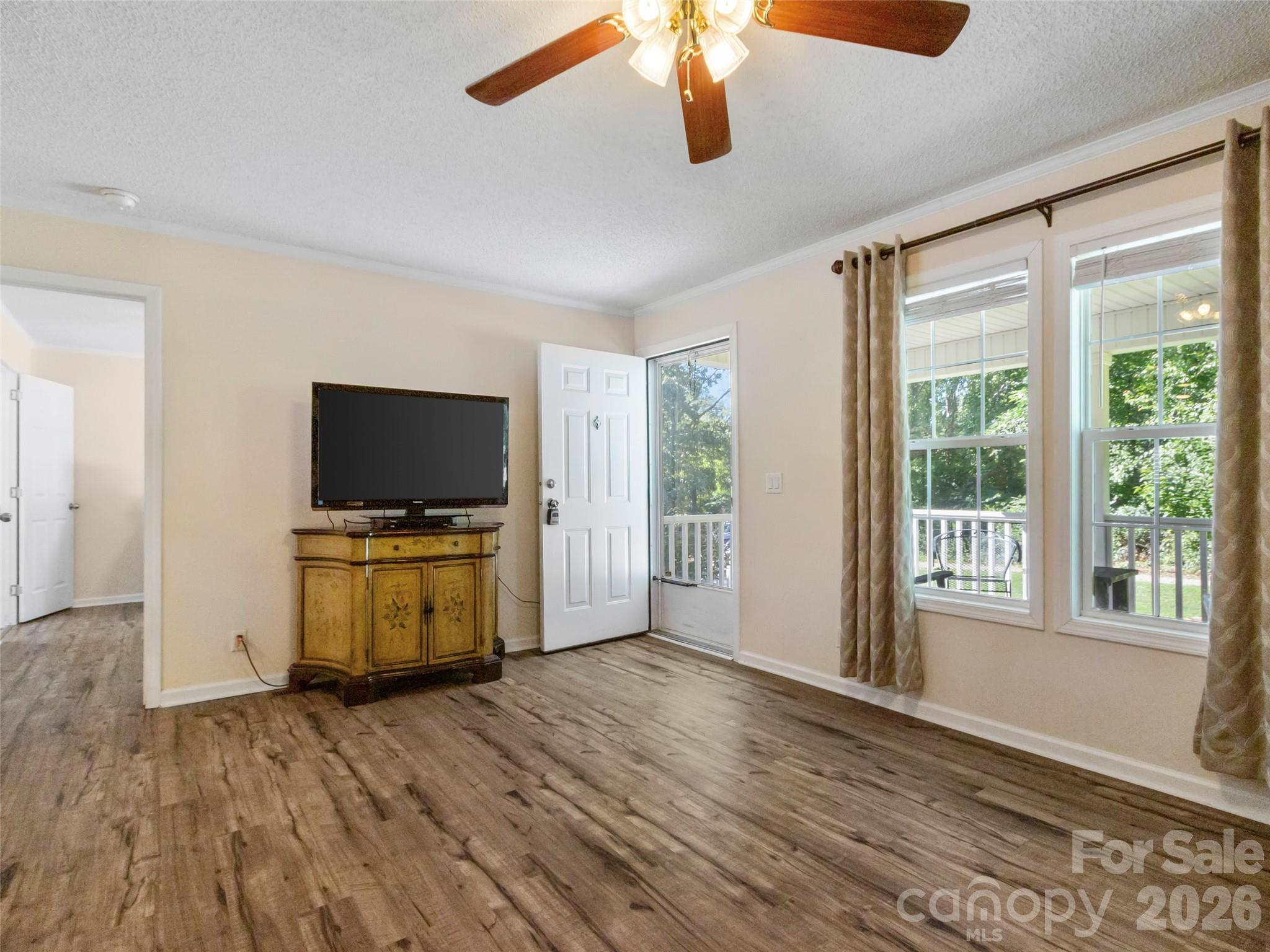 9 Sun Ridge Road Asheville, NC 28806 - Photo 4 of 29 a view of room with wooden floor and windows