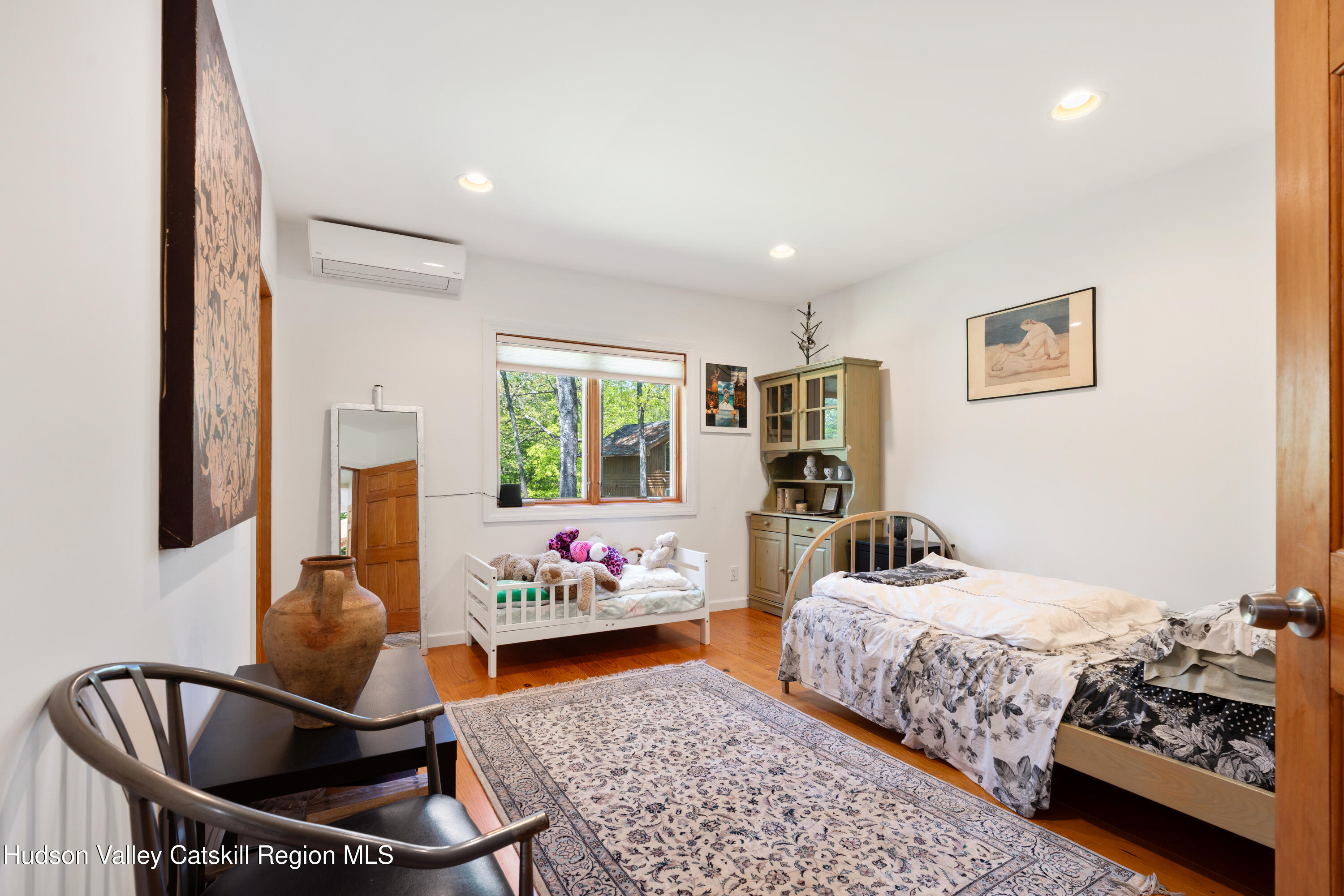 537 Mossy Hill Road Catskill, NY 12414 - Photo 61 of 105 a bedroom with bed couch and window