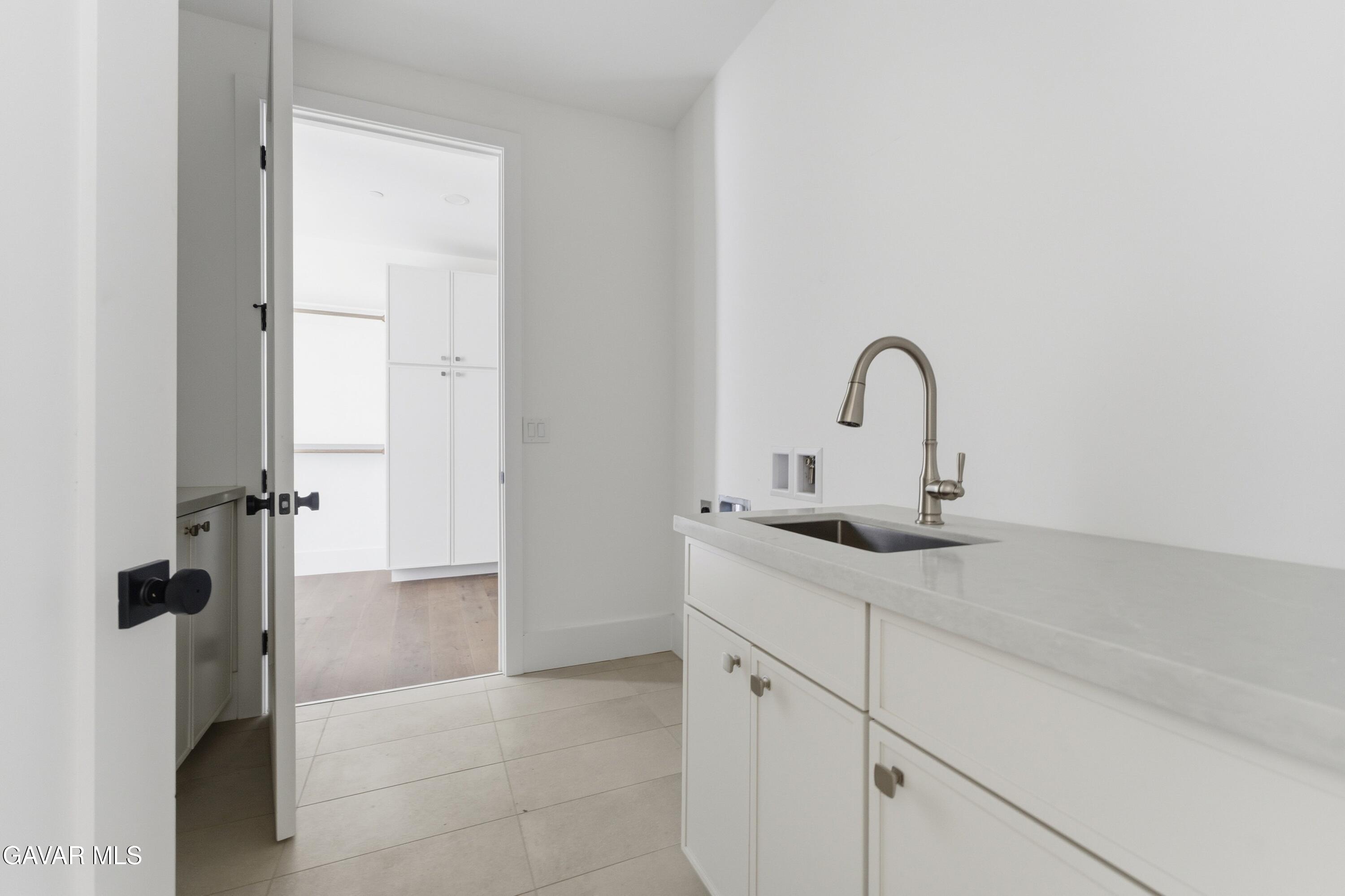 24401 Oaktree Court Tehachapi, CA 93561 - Photo 21 of 36 a close view of a sink and tap