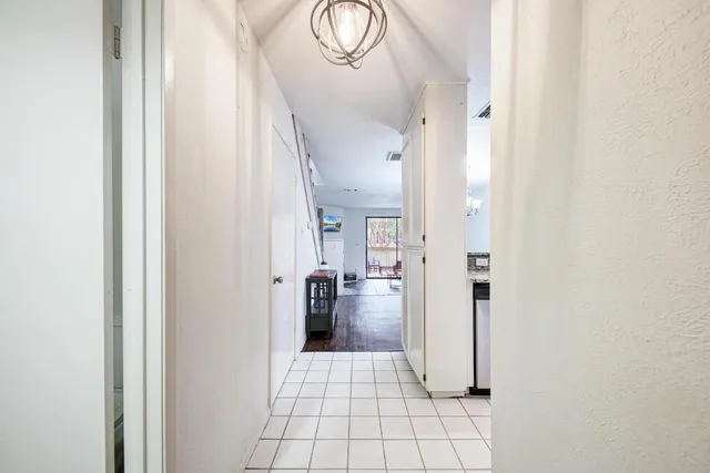 a view of entryway and kitchen