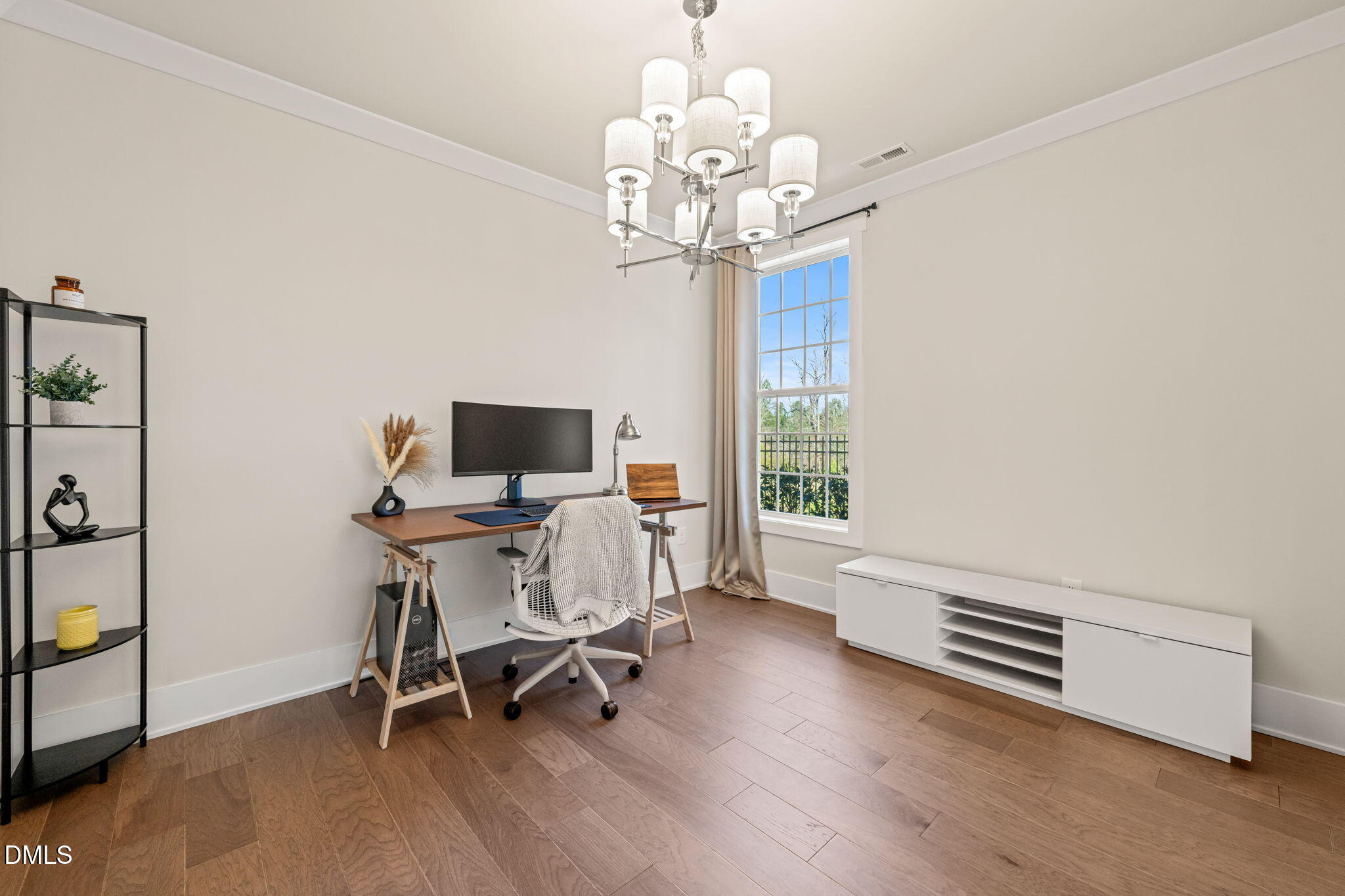 10320 Sablewood Drive, Unit 108 Raleigh, NC 27617 - Photo 11 of 34 a view of a dining room with furniture a chandelier and wooden floor