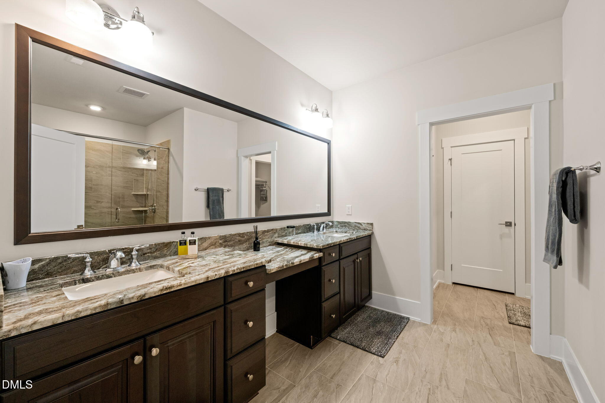 10320 Sablewood Drive, Unit 108 Raleigh, NC 27617 - Photo 15 of 34 a spacious bathroom with a granite countertop double vanity sink and a mirror