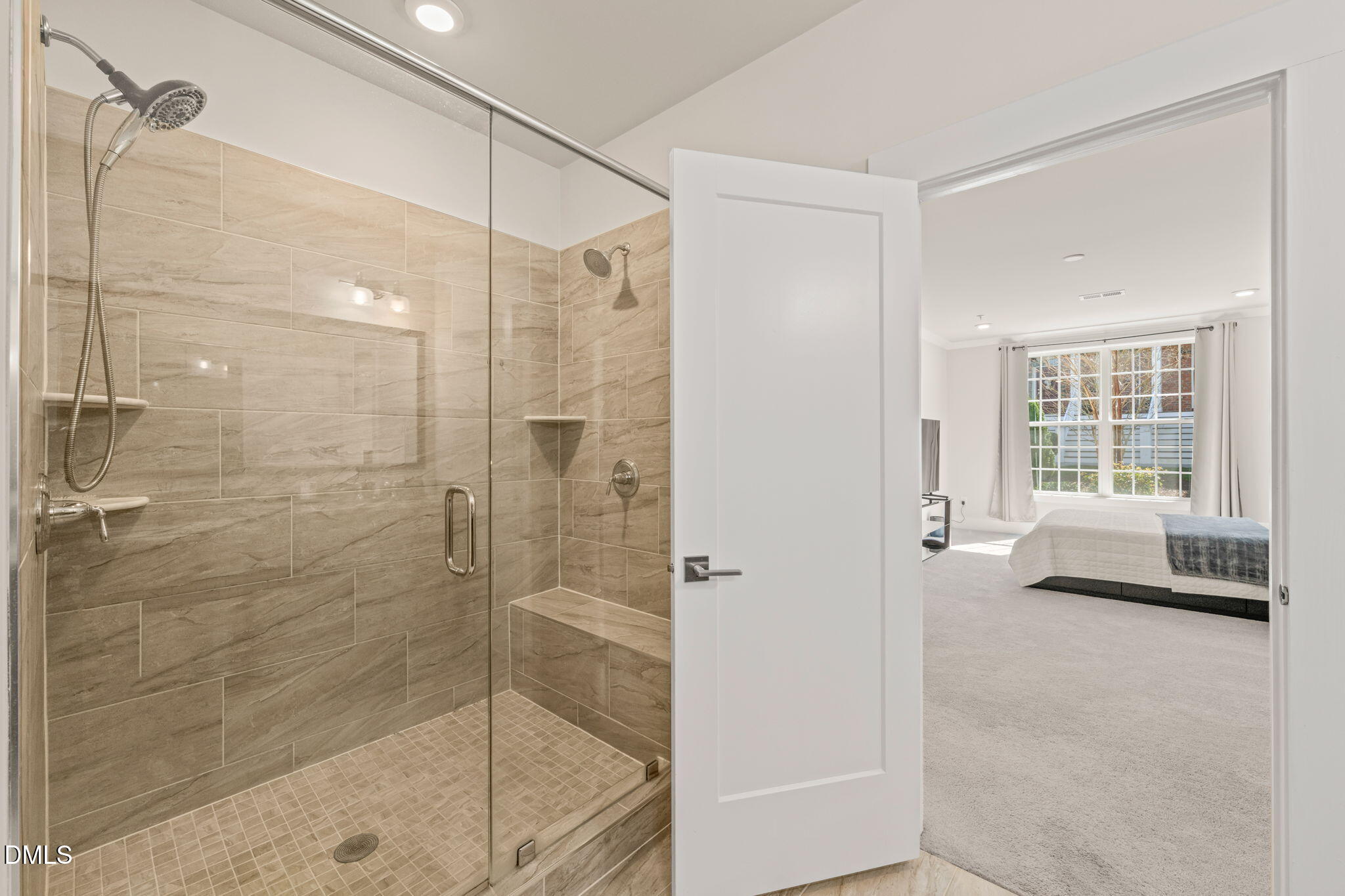 10320 Sablewood Drive, Unit 108 Raleigh, NC 27617 - Photo 16 of 34 a bathroom with a shower and a bathtub