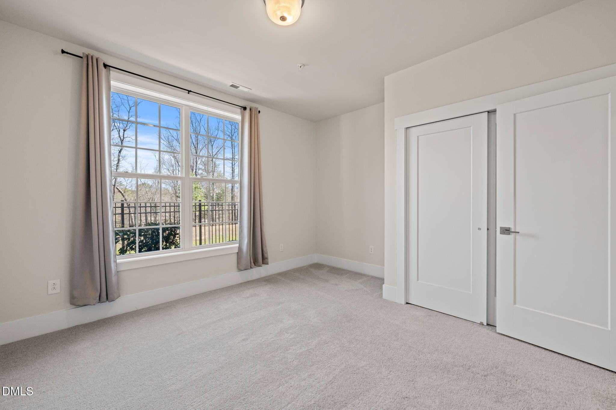 10320 Sablewood Drive, Unit 108 Raleigh, NC 27617 - Photo 18 of 34 a view of an empty room with a window