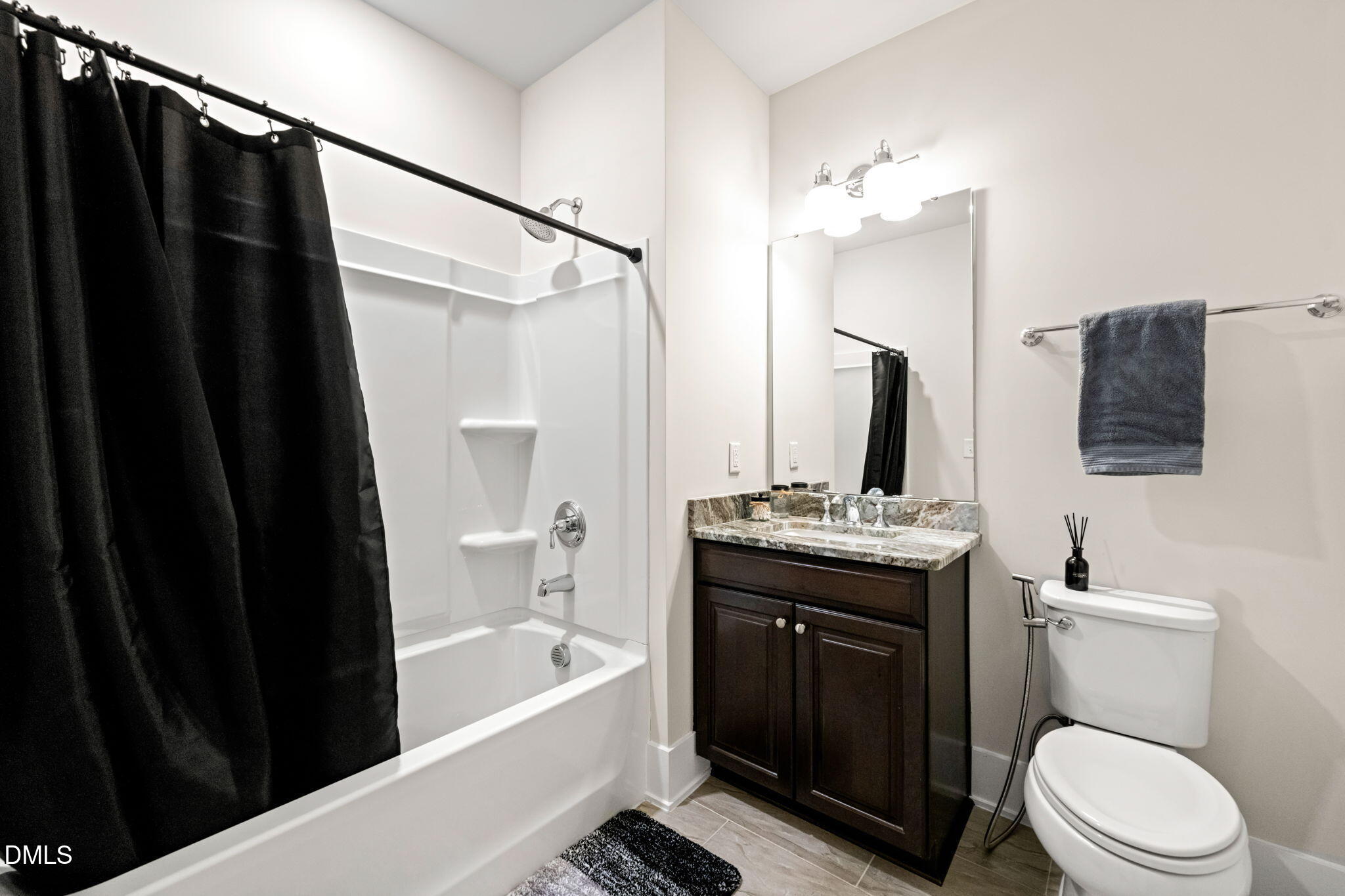 10320 Sablewood Drive, Unit 108 Raleigh, NC 27617 - Photo 20 of 34 a bathroom with a granite countertop sink toilet and shower