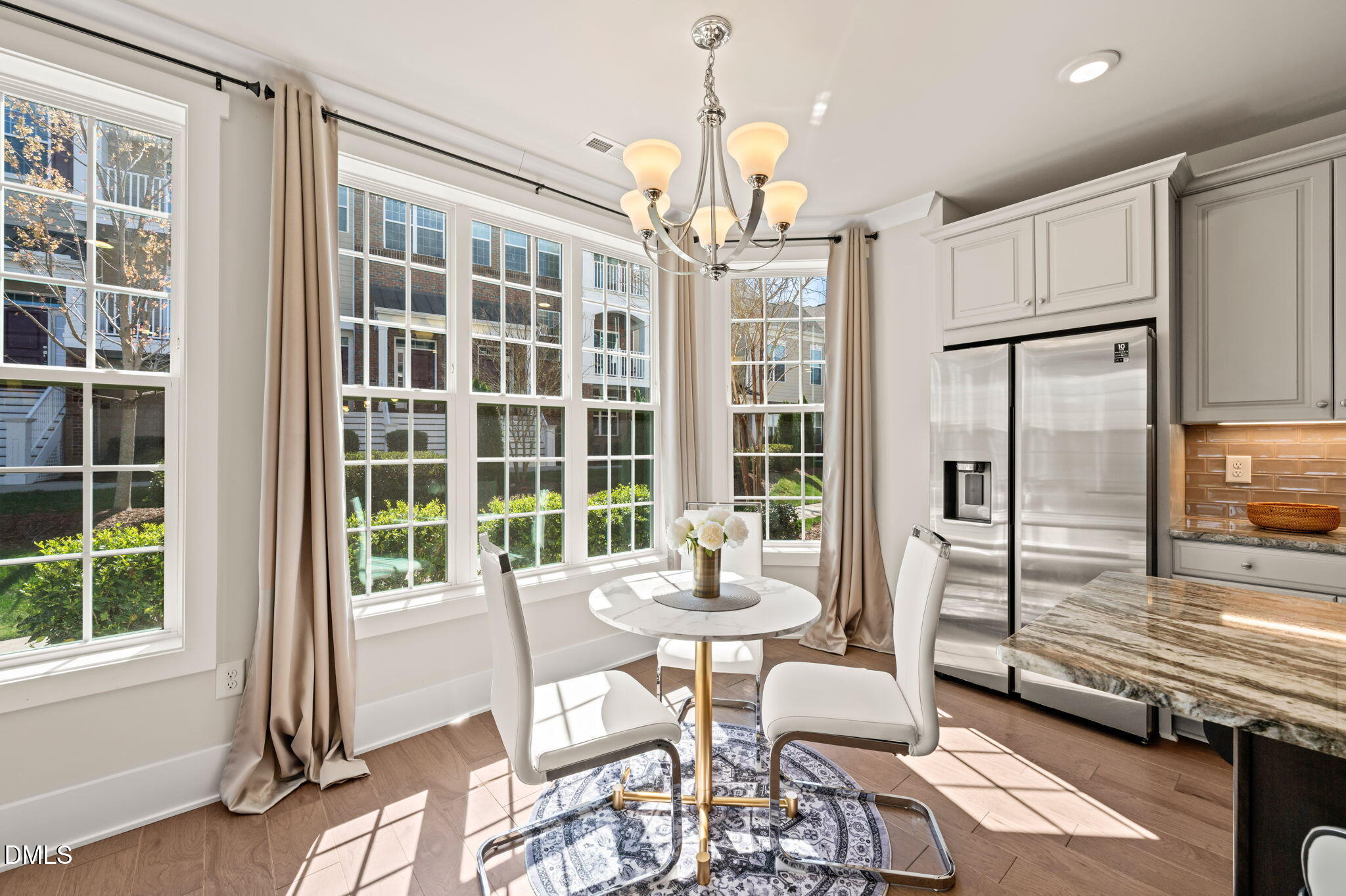 10320 Sablewood Drive, Unit 108 Raleigh, NC 27617 - Photo 4 of 34 a dining room with furniture and window
