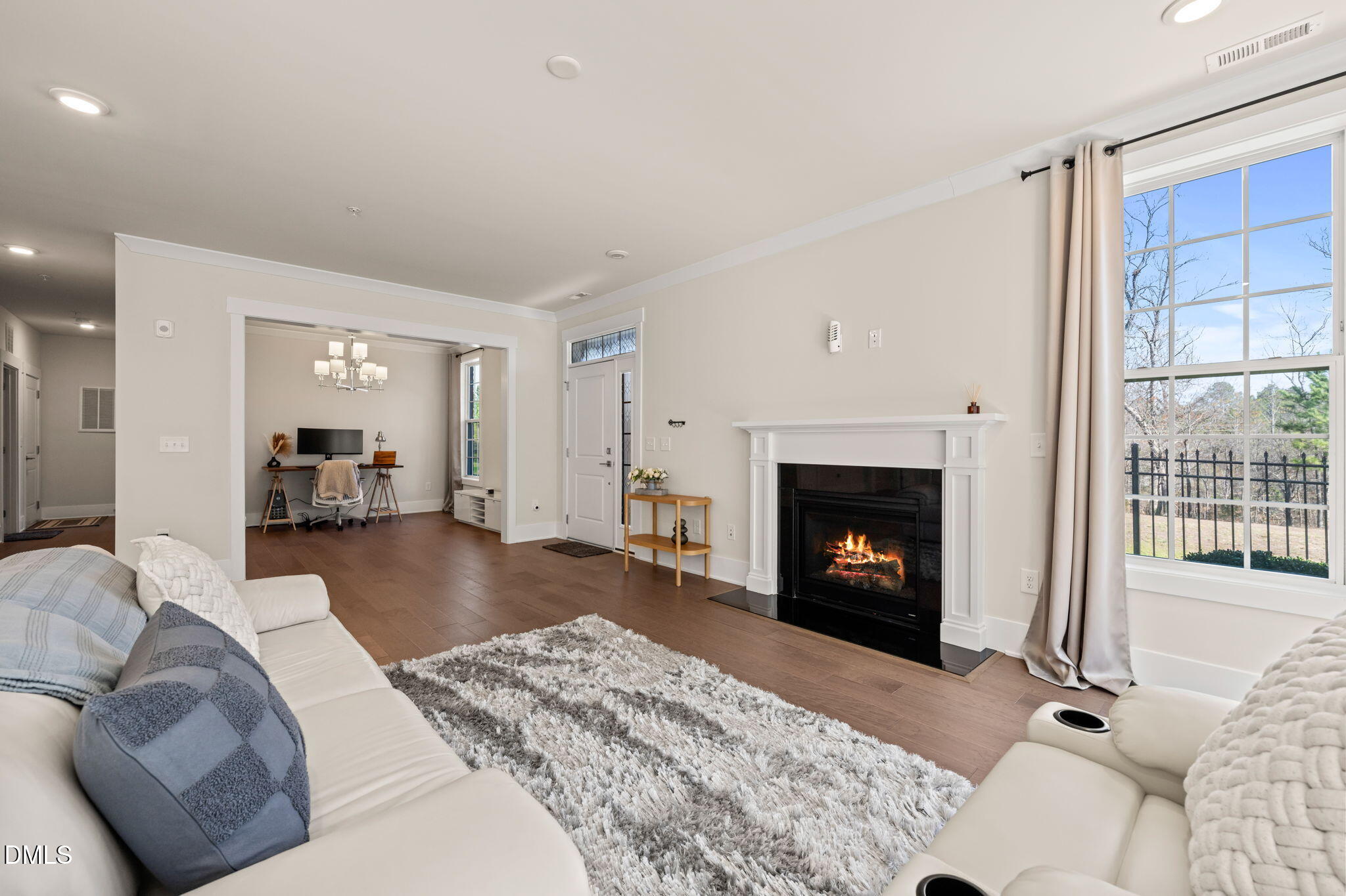 10320 Sablewood Drive, Unit 108 Raleigh, NC 27617 - Photo 9 of 34 a living room with furniture and a fireplace