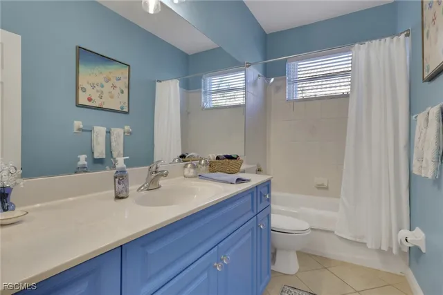 a bathroom with a sink a toilet and bathtub