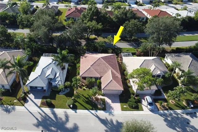 an aerial view of house with yard swimming pool and outdoor seating