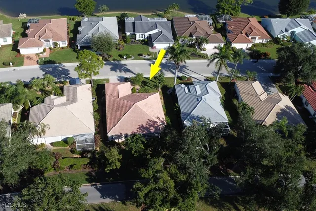 an aerial view of multiple houses with yard