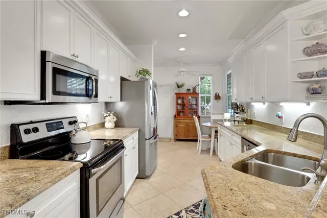 a kitchen with a stove sink and refrigerator