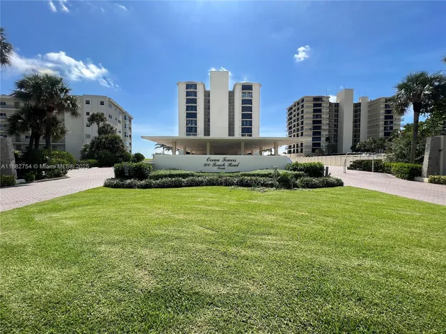 a large building with trees in front of it