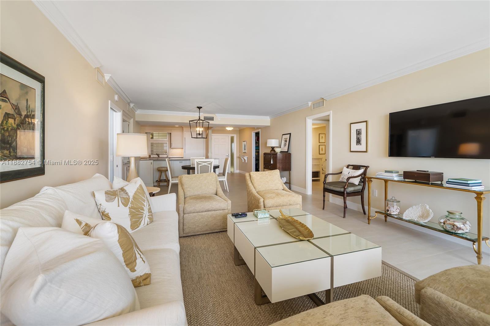 200 South Beach Road, Unit 202 Tequesta, FL 33469 - Photo 16 of 45 a living room with furniture and a flat screen tv