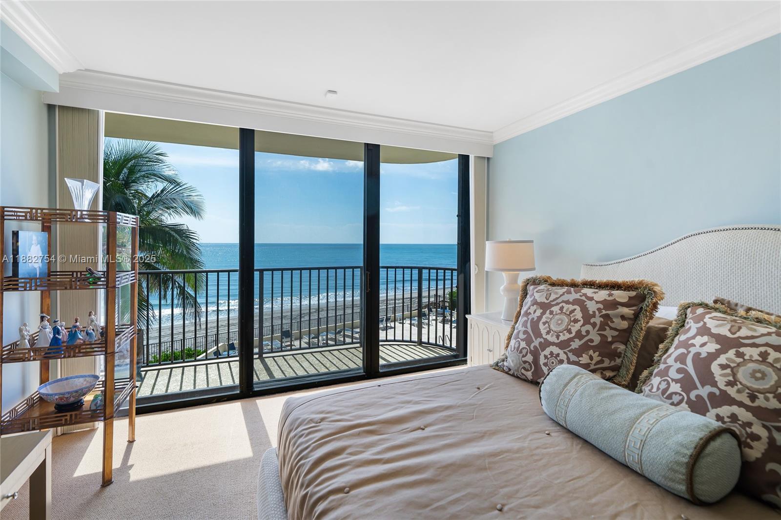 200 South Beach Road, Unit 202 Tequesta, FL 33469 - Photo 19 of 45 a bedroom with a bed and a large window