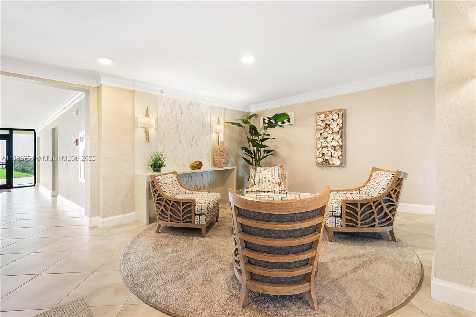 200 South Beach Road, Unit 202 Tequesta, FL 33469 - Photo 2 of 45 a living room with furniture and wooden floor