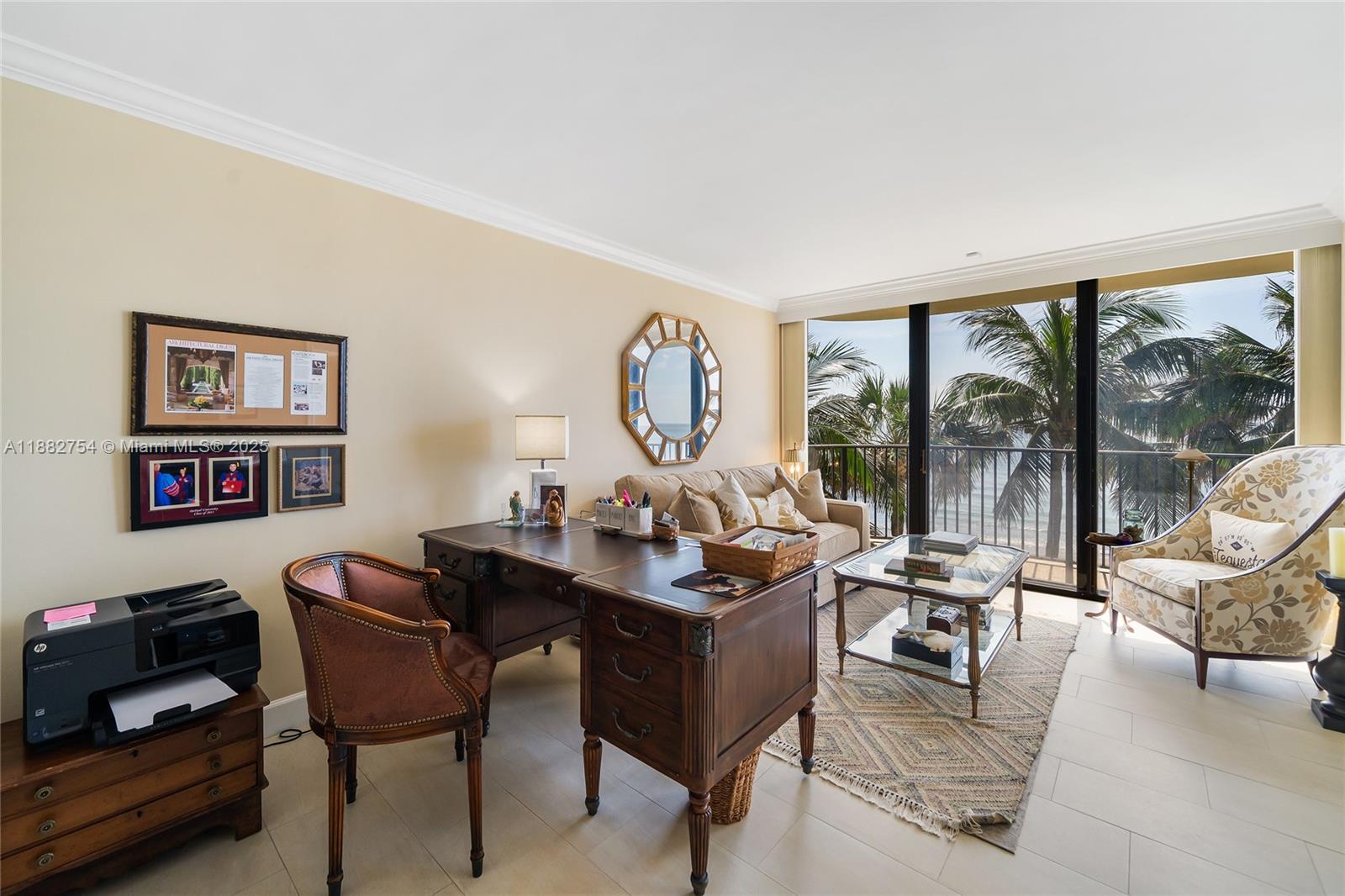 200 South Beach Road, Unit 202 Tequesta, FL 33469 - Photo 28 of 45 a living room with furniture a large window and a table