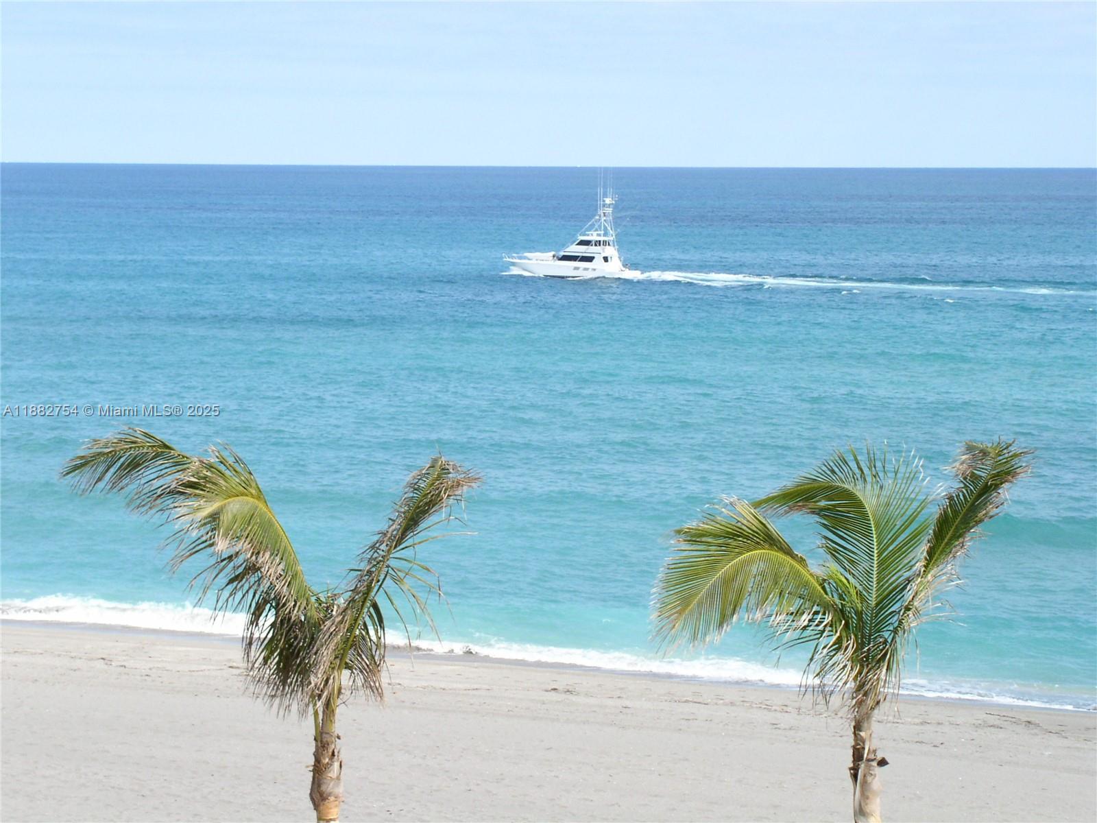 200 South Beach Road, Unit 202 Tequesta, FL 33469 - Photo 3 of 45 a view of beach and ocean view
