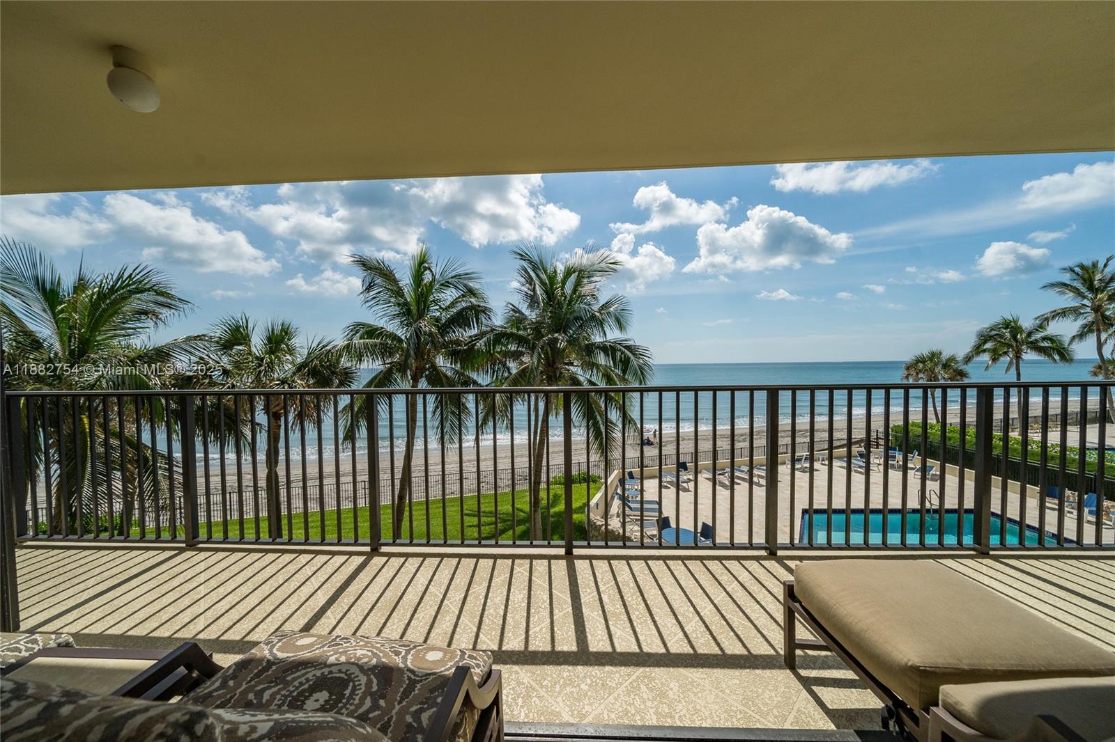 200 South Beach Road, Unit 202 Tequesta, FL 33469 - Photo 32 of 45 a view of a balcony with wooden floor and lake view
