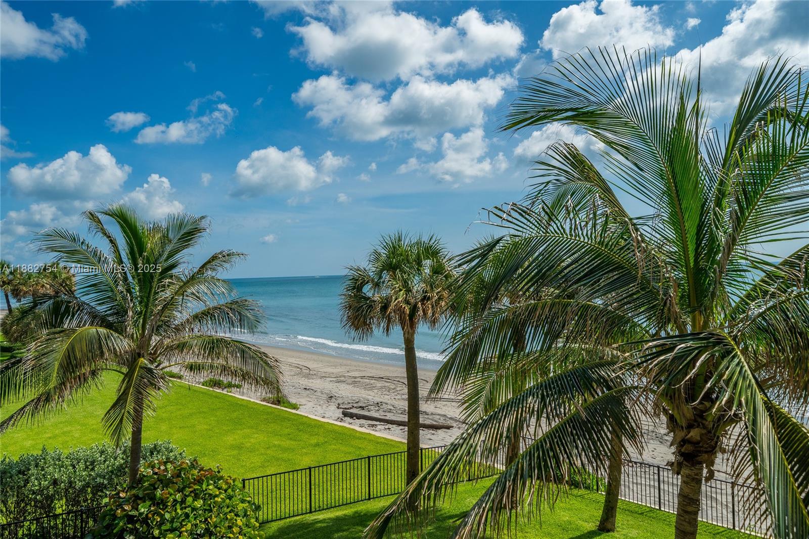 200 South Beach Road, Unit 202 Tequesta, FL 33469 - Photo 38 of 45 a view of a palm trees in front of a house