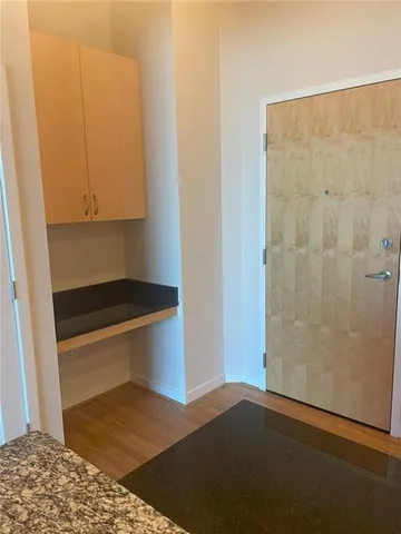 a kitchen with granite countertop cabinets and steel stainless steel appliances