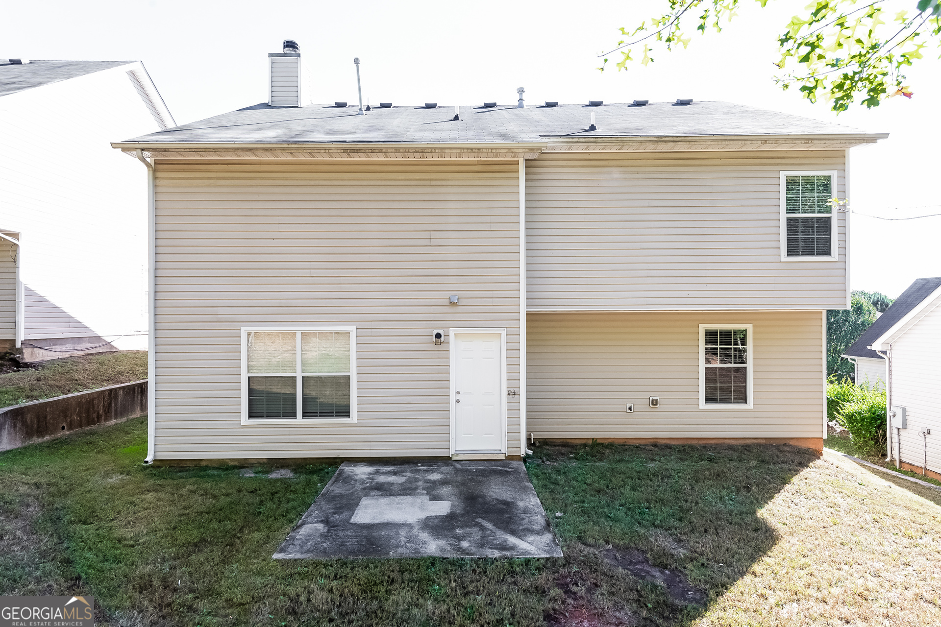 6998 ⛉ Bonnes Boulevard Austell, GA 30168 - Photo 15 of 15 a view of a house with a yard