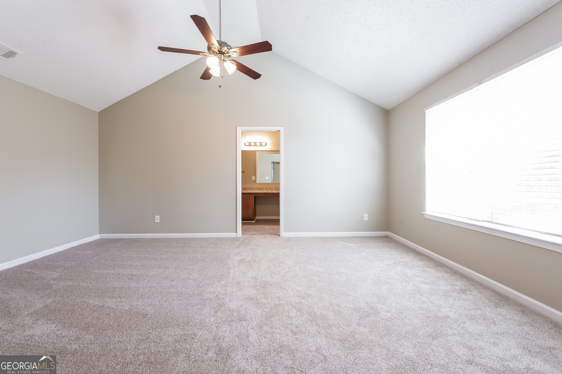 6998 ⛉ Bonnes Boulevard Austell, GA 30168 - Photo 8 of 15 an empty room with fan and windows