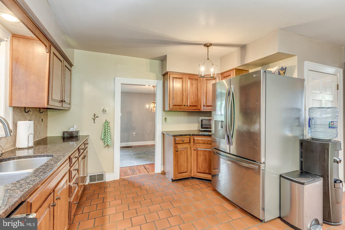 15 East 2nd Street Moorestown, NJ 08057 - Photo 29 of 52 a kitchen with granite countertop a refrigerator and a sink