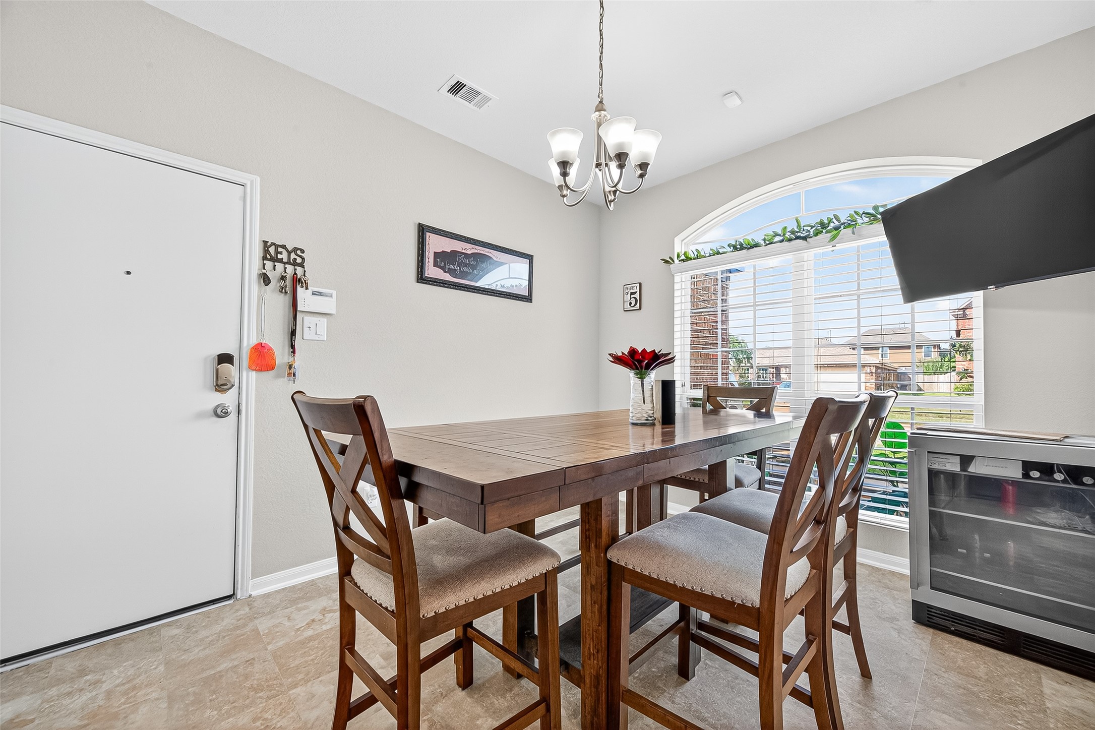2611 Cottage Step Trail Fresno, TX 77545 - Photo 20 of 48 a view of a dining room with furniture a chandelier and wooden floor