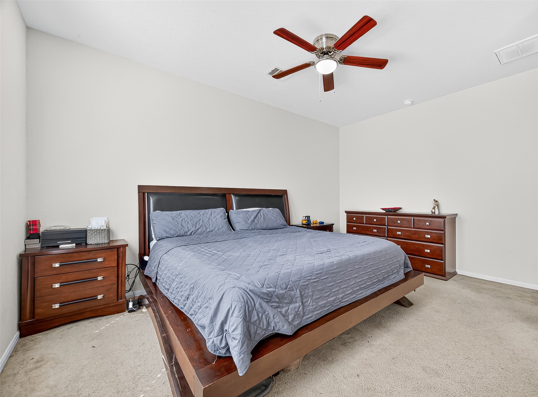 2611 Cottage Step Trail Fresno, TX 77545 - Photo 25 of 48 a bedroom with a bed and a chandelier
