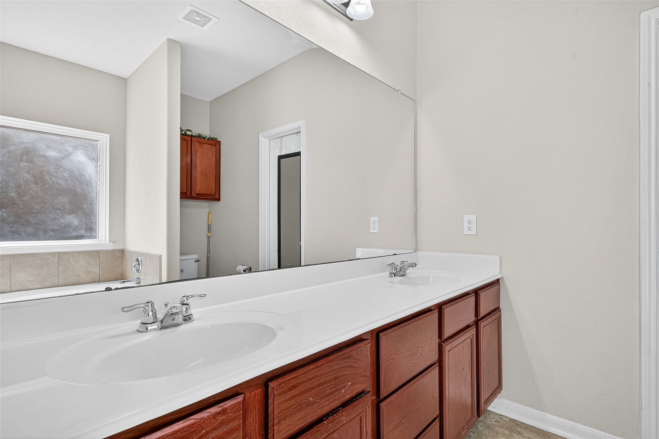 2611 Cottage Step Trail Fresno, TX 77545 - Photo 27 of 48 a bathroom with a sink and a mirror