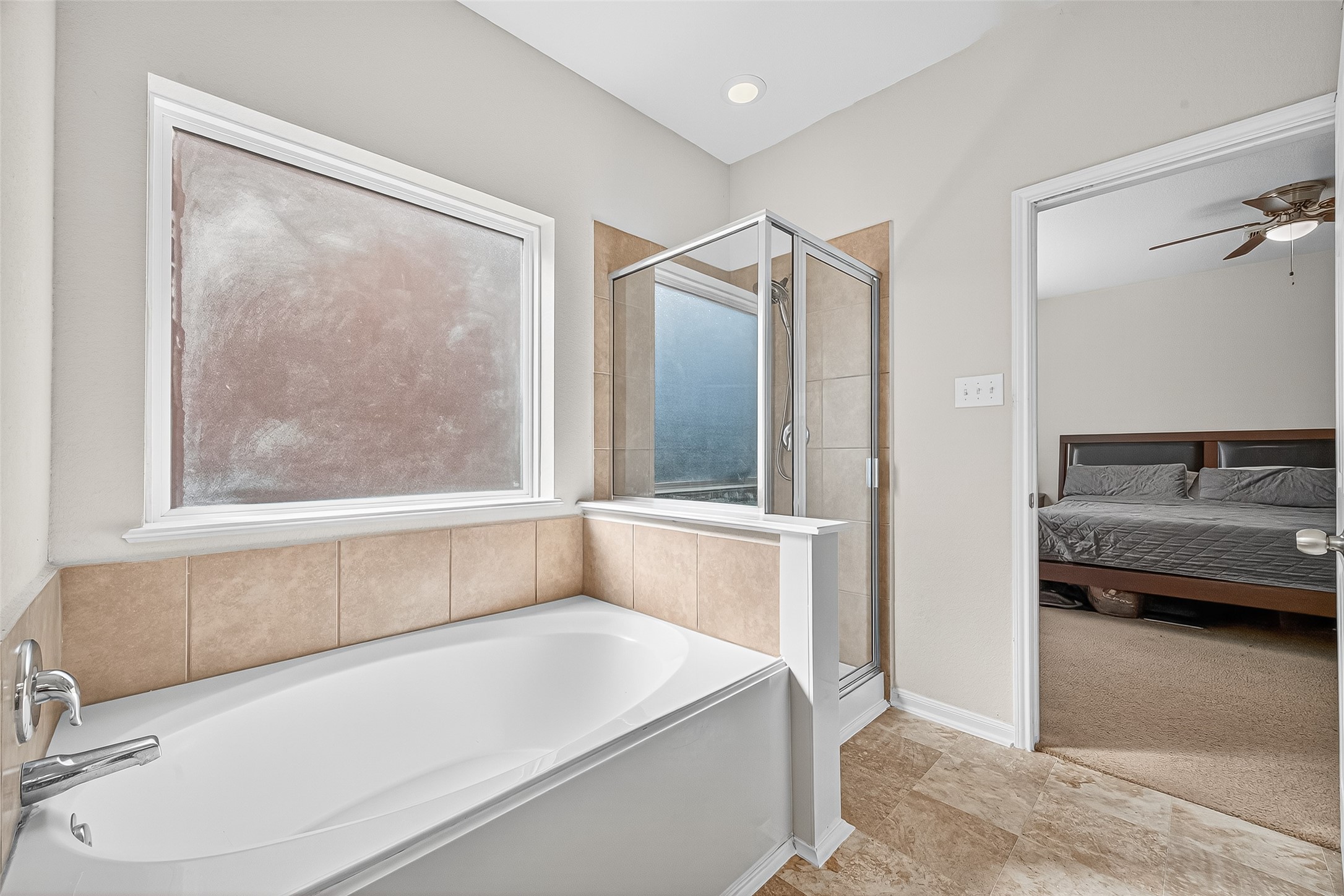 2611 Cottage Step Trail Fresno, TX 77545 - Photo 28 of 48 a bathroom with a tub and a shower