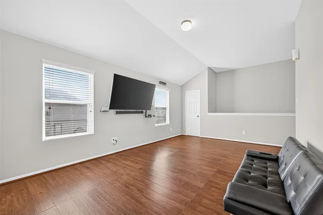 a view of livingroom with furniture wooden floor and window
