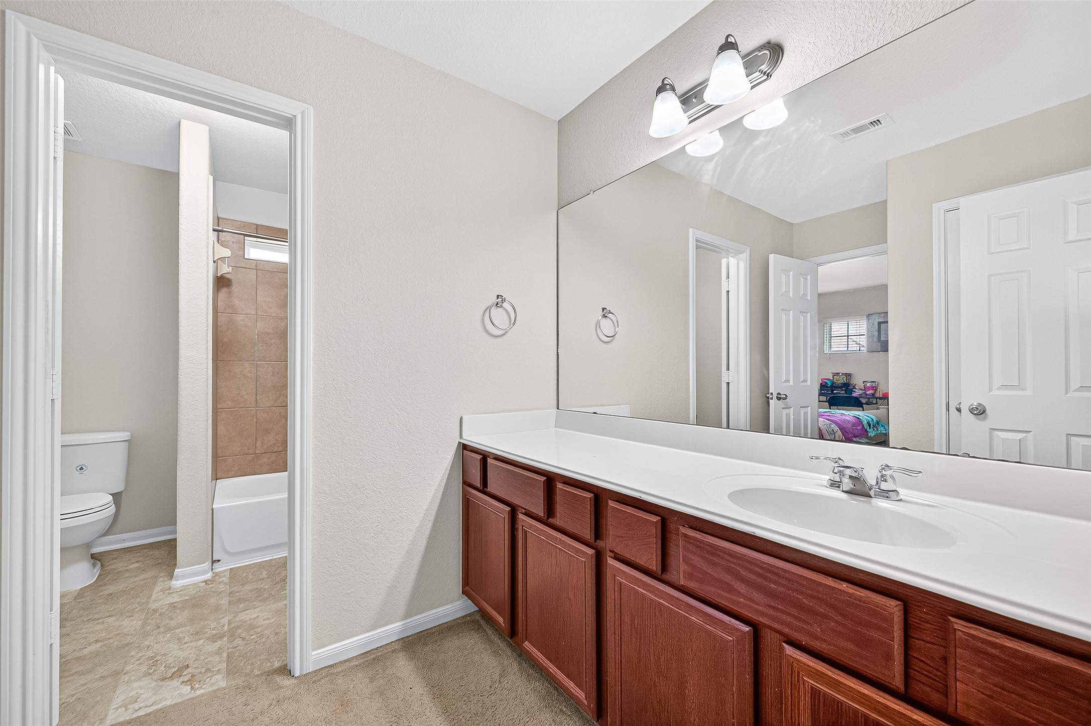 2611 Cottage Step Trail Fresno, TX 77545 - Photo 35 of 48 a bathroom with a sink double vanity and a mirror