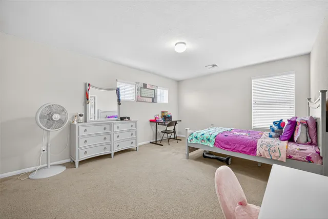 a bedroom with furniture and a couch