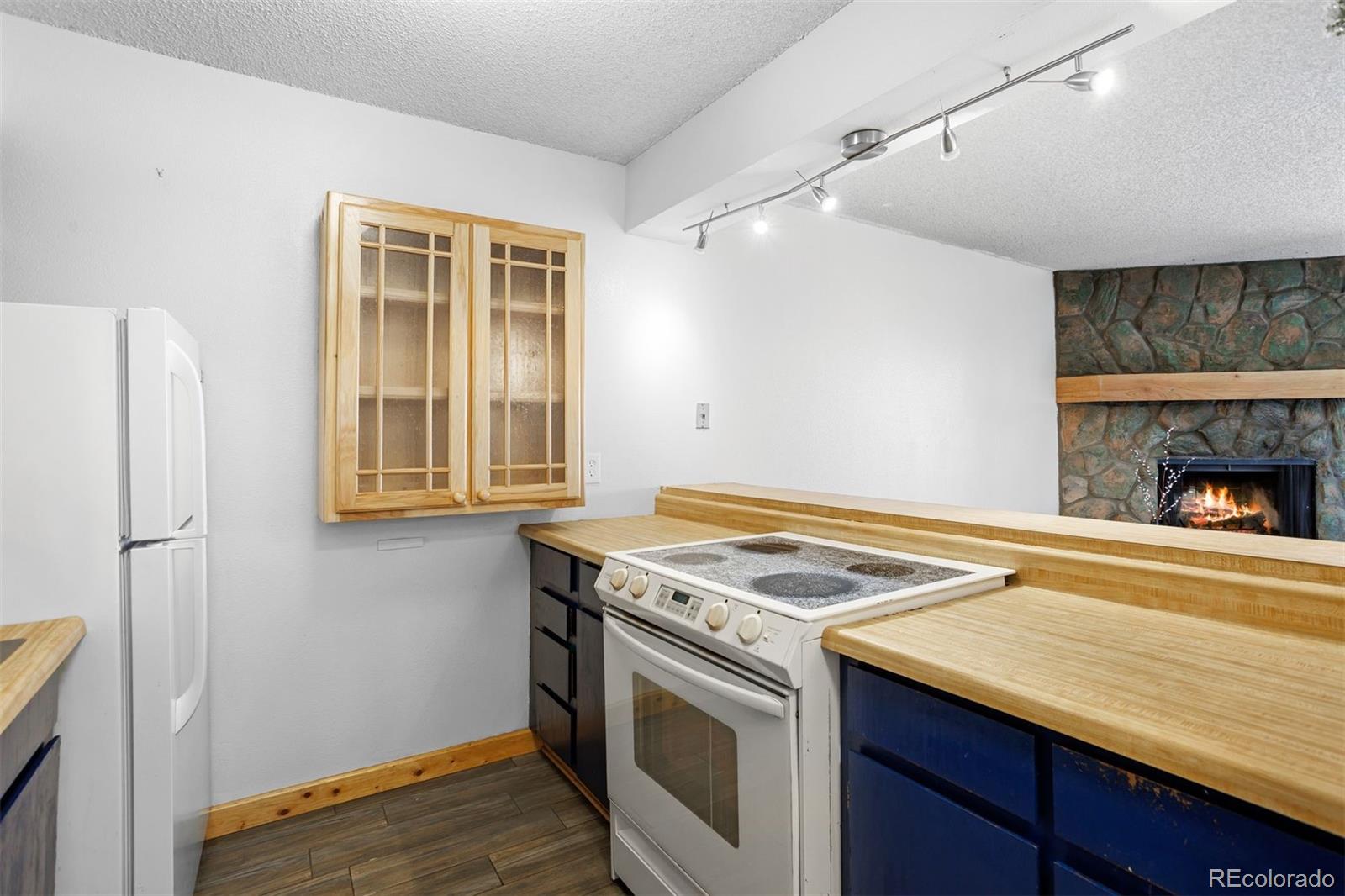 76 E Meadow, Unit 2 Fraser, CO 80442 - Photo 11 of 23 a stove top oven sitting inside of a kitchen