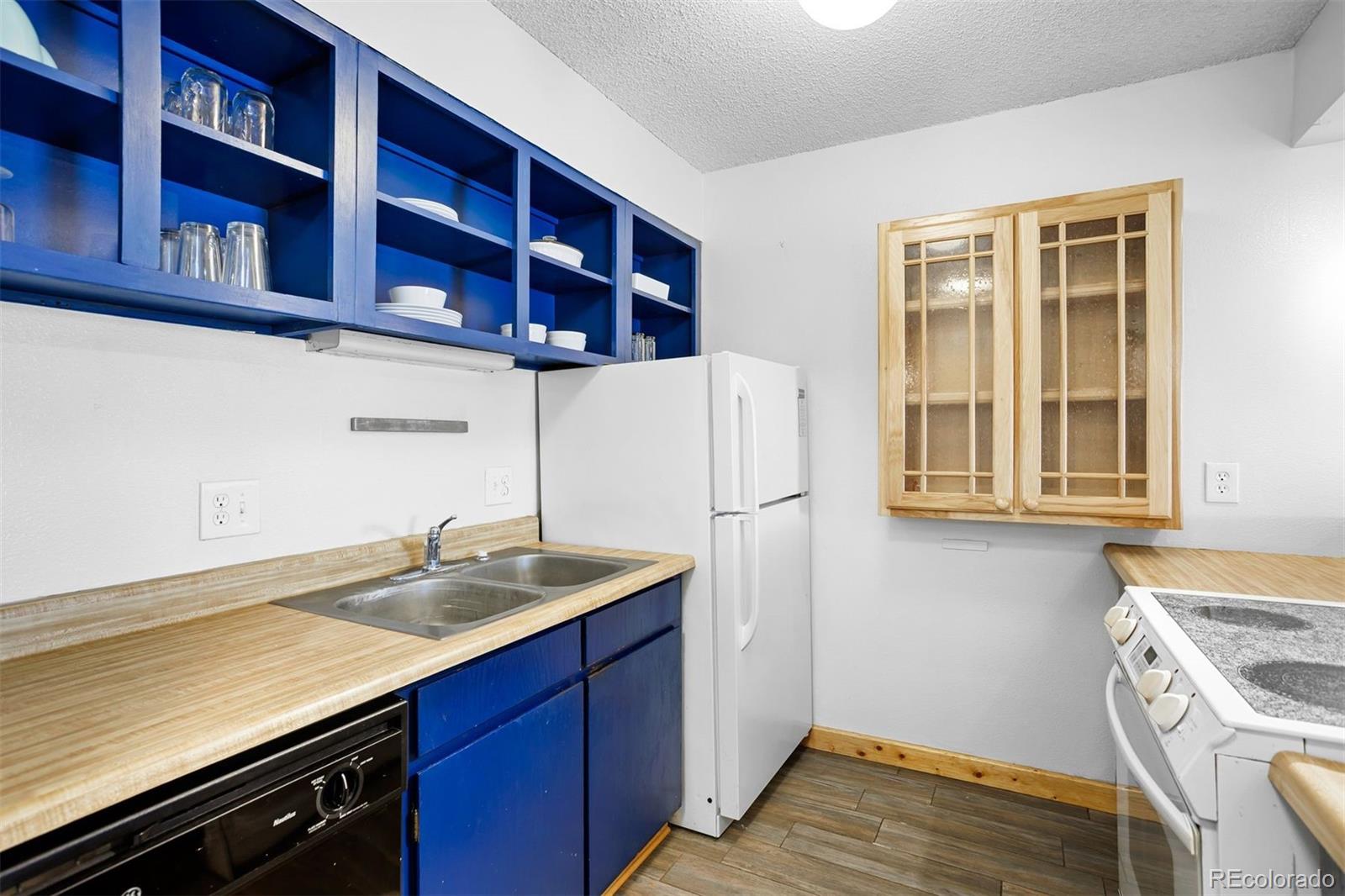 76 E Meadow, Unit 2 Fraser, CO 80442 - Photo 13 of 23 a kitchen with a sink and cabinets