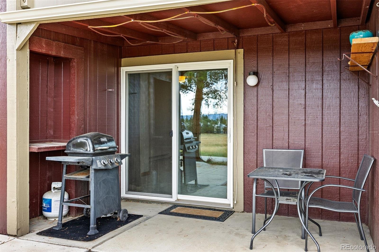 76 E Meadow, Unit 2 Fraser, CO 80442 - Photo 20 of 23 a patio with table and chairs