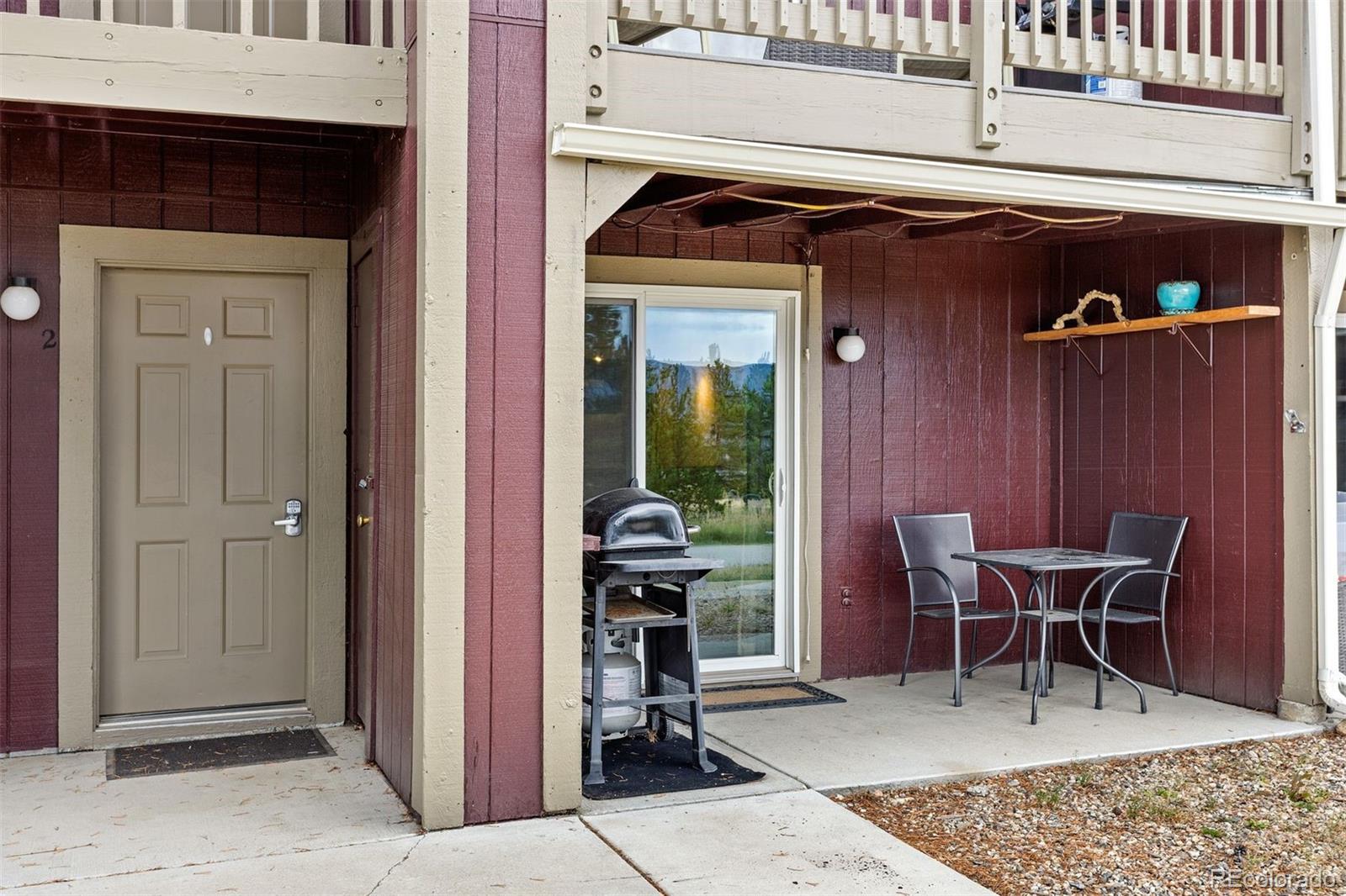 76 E Meadow, Unit 2 Fraser, CO 80442 - Photo 2 of 23 a view of a front door and deck with a chair