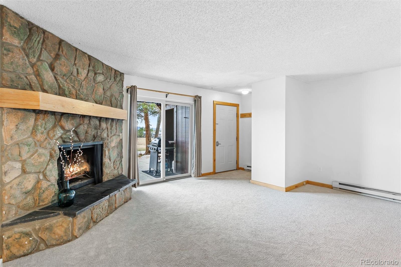 76 E Meadow, Unit 2 Fraser, CO 80442 - Photo 4 of 23 a view of an empty room and fire place