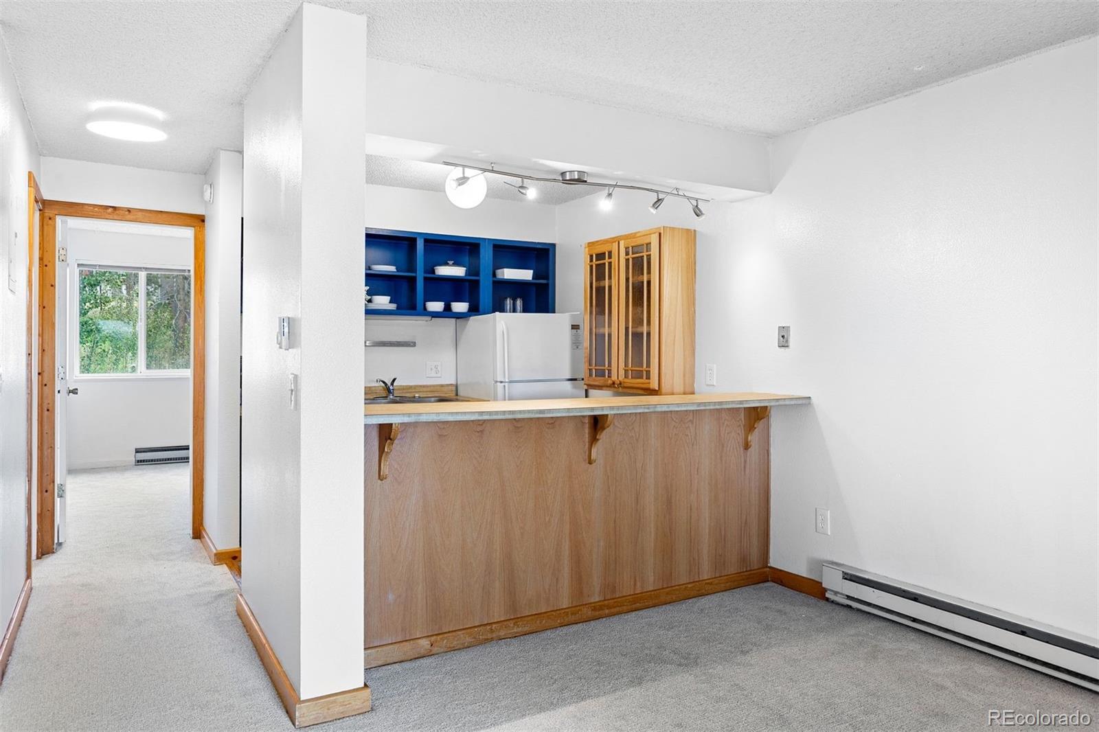 76 E Meadow, Unit 2 Fraser, CO 80442 - Photo 10 of 23 a view of kitchen with refrigerator and window