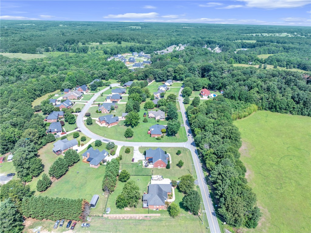 648 Mountain View Road Williamston, SC 29697 - Photo 40 of 42 An aerial perspective reveals a residential community nestled among lush green landscapes.