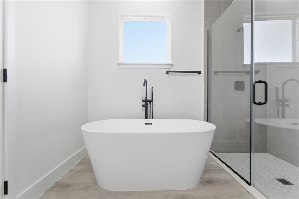 2600 Southwest 146th Pl Road Ocala, FL 34473 - Photo 26 of 40 a white bath tub sitting next to a shower