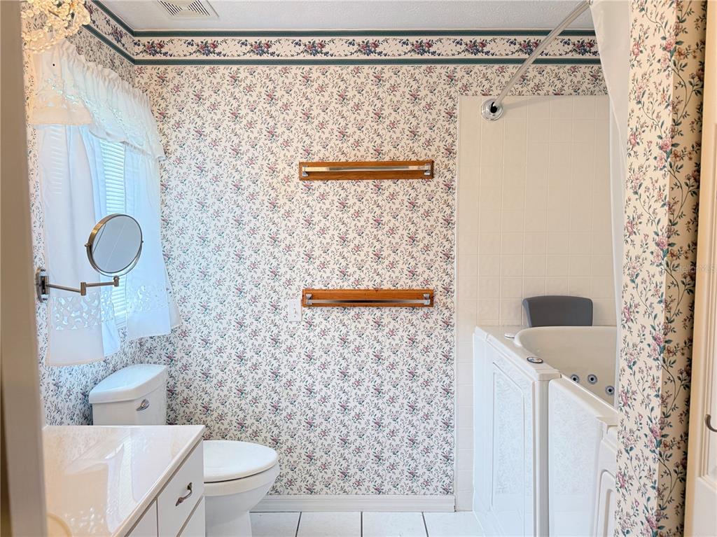 4262 Northeast 35th Avenue Road Ocala, FL 34479 - Photo 15 of 28 a bathroom with a shower curtain