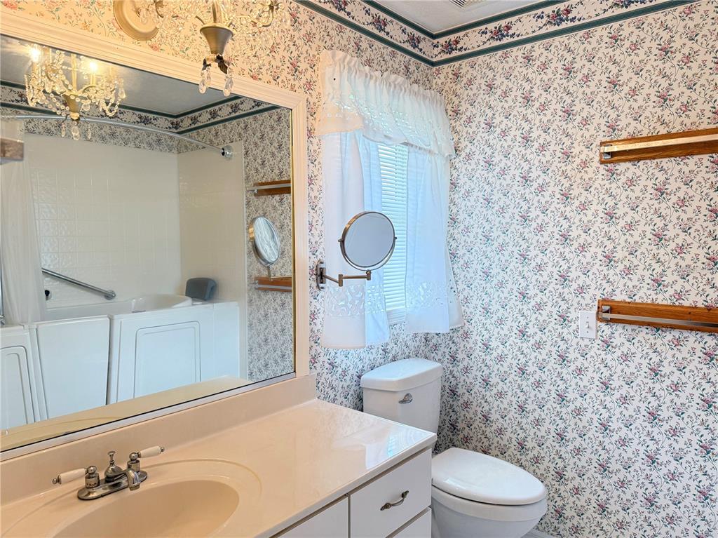 4262 Northeast 35th Avenue Road Ocala, FL 34479 - Photo 16 of 28 a bathroom with a sink toilet and shower